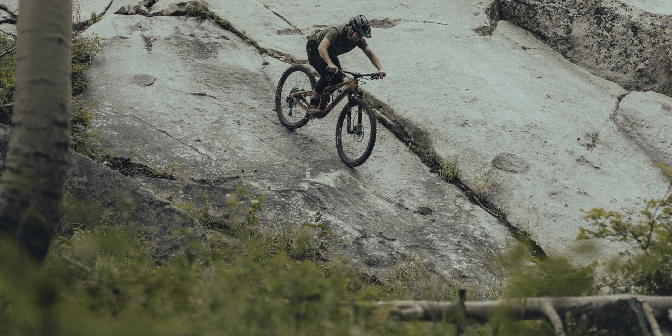 MTB biker going down a slab with TRP brakes