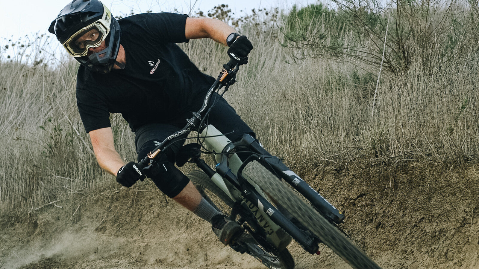 Man in turn on downhill bike with EVO X breaks