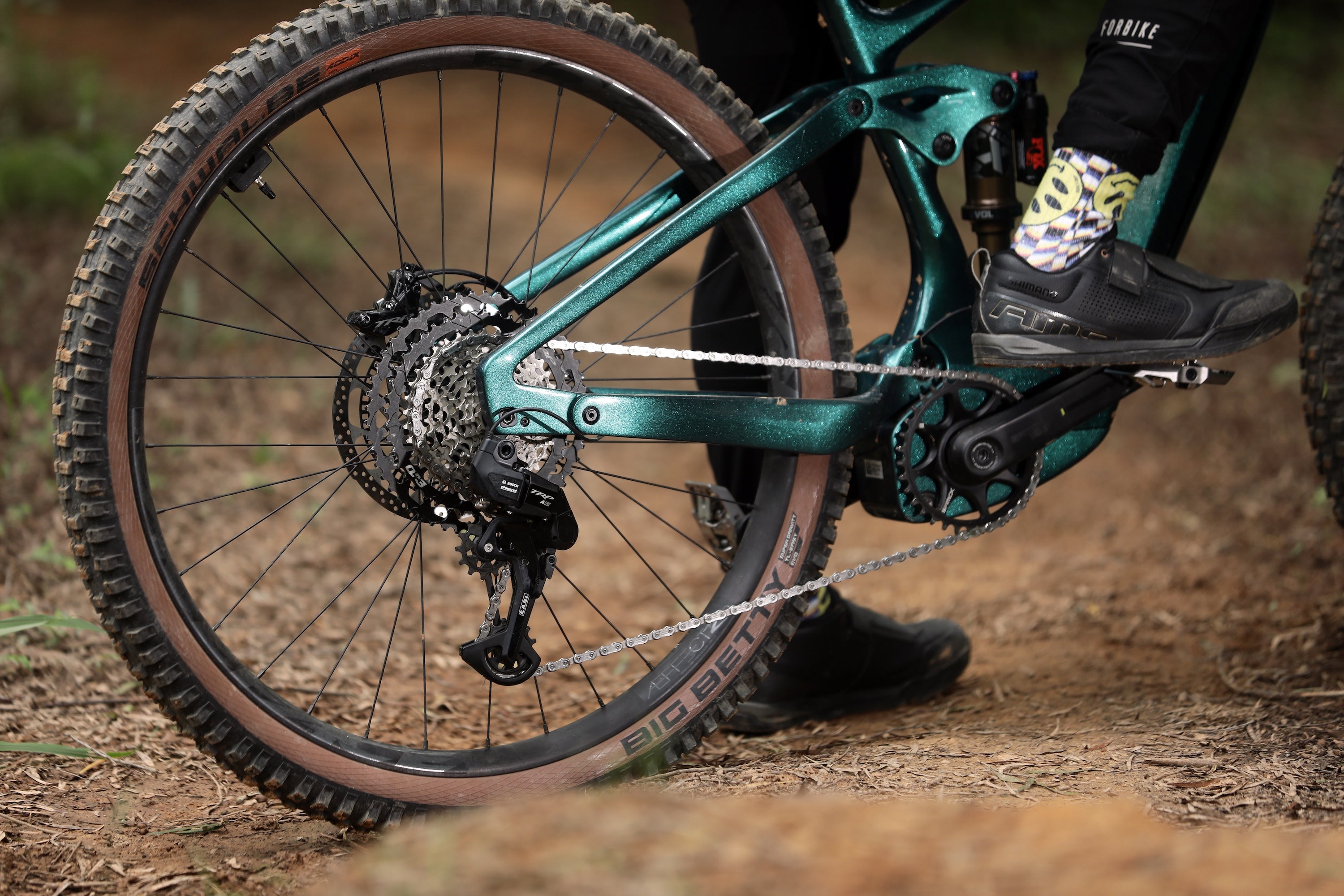 Close-up of an e-mountain bike with EASI A12 group set on a dirt trail