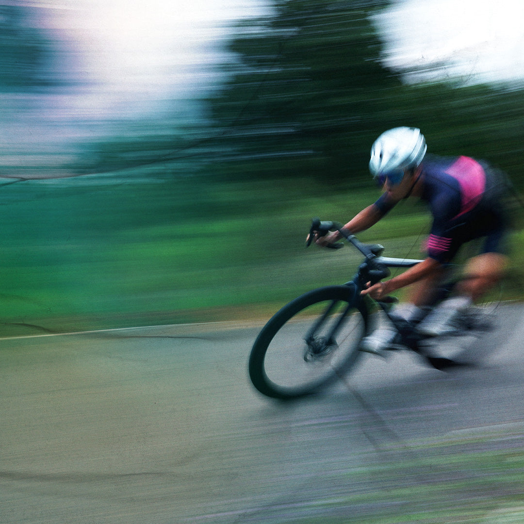 Person riding a bicycle on a blurred background
