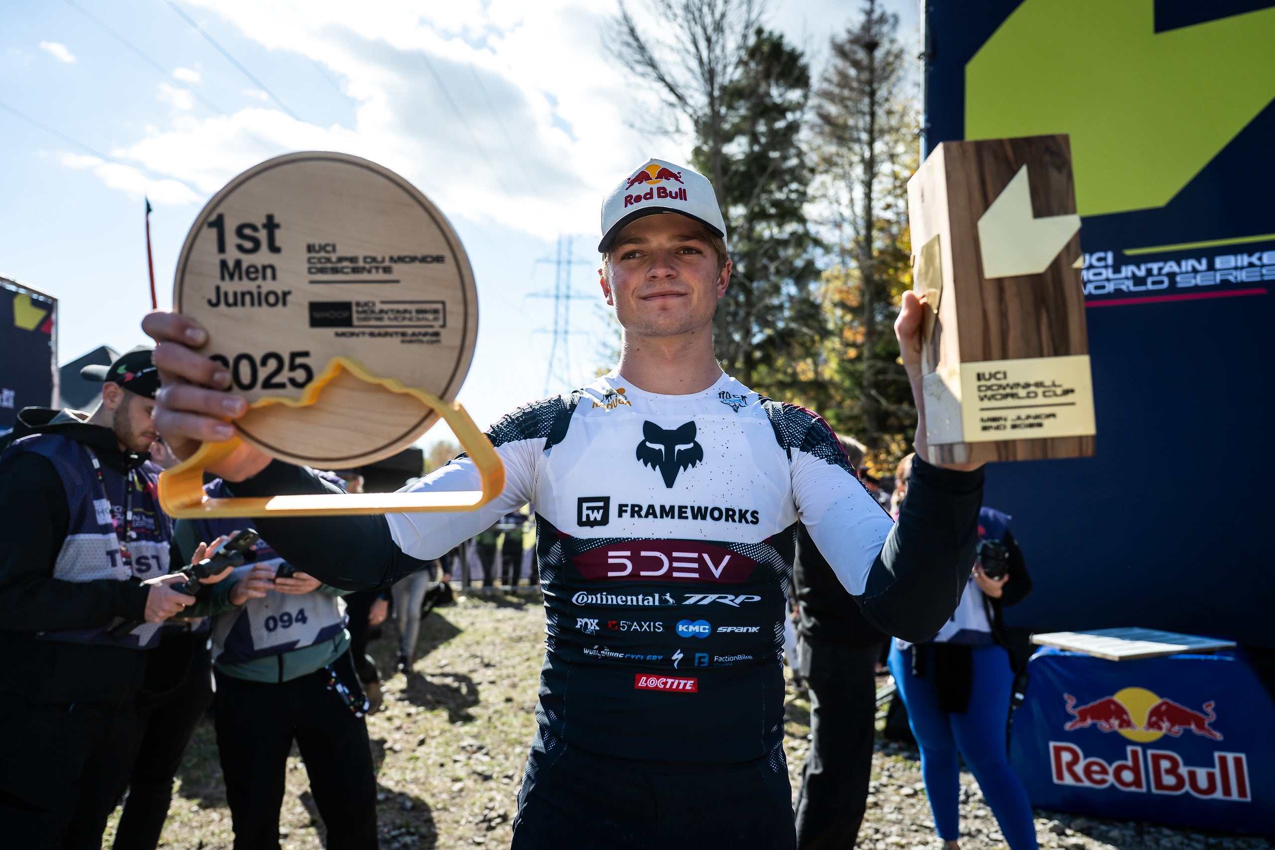 TRP team rider Asa holding trophies with '1st Men Junior 2025' branding, of UCI MTB world tour series